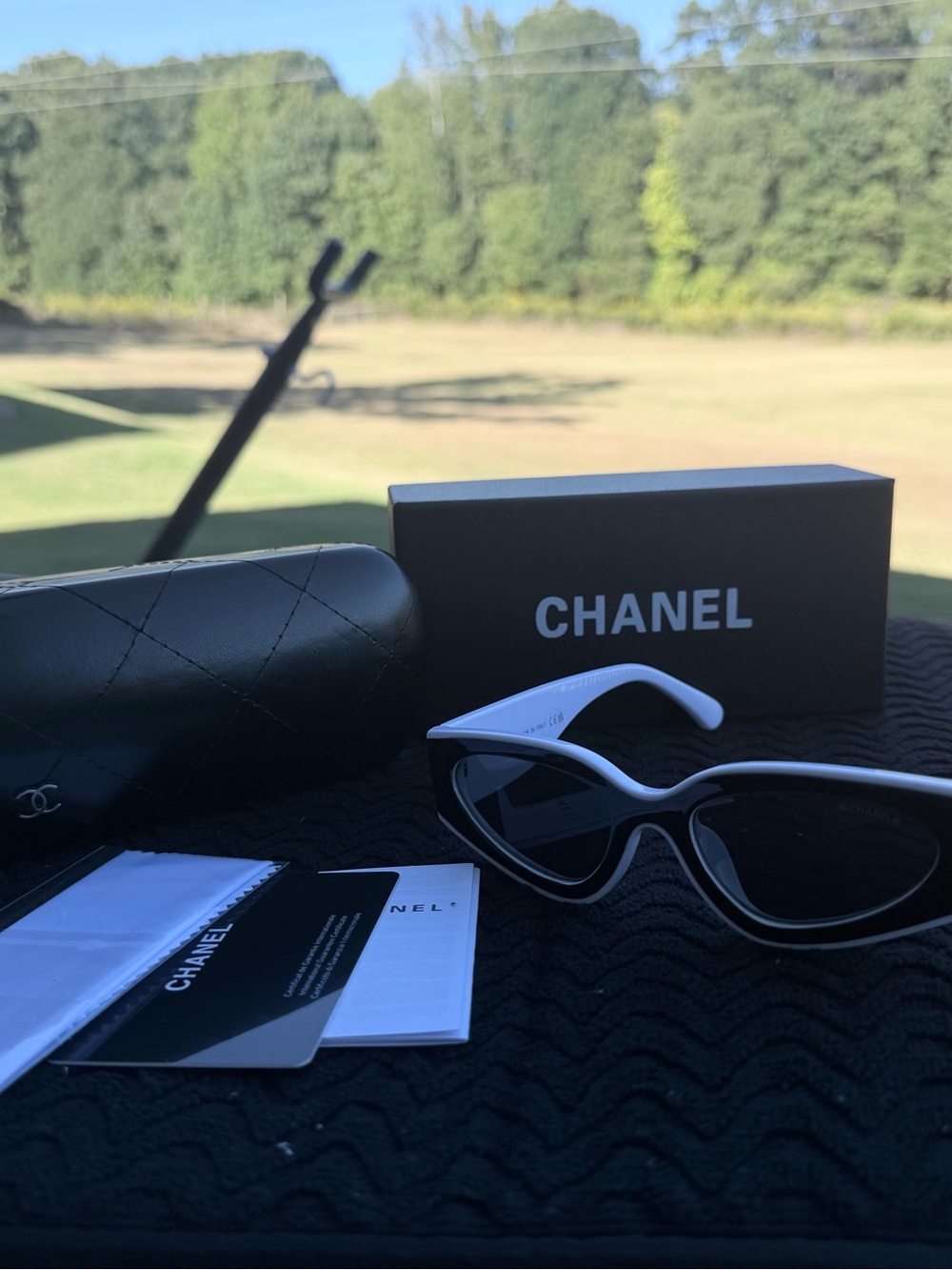 CHANEL Black & White Cat-Eye Sunglasses with Dark Lenses